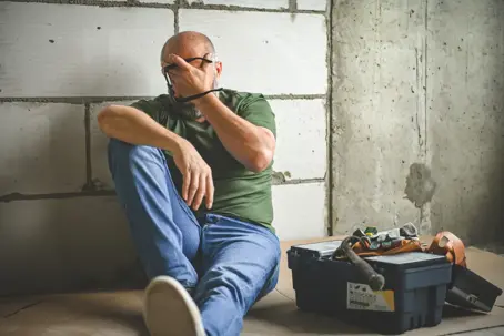 Man is doing renovations in a new house.